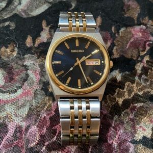 Gold and silver colored Seiko men’s watch